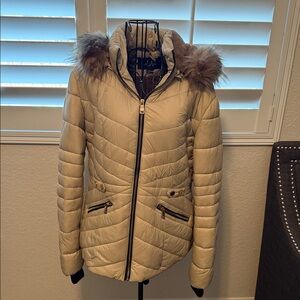 Elegant Women's Tan Puffer Jacket with detachable Faux Fur and detachable Hood.